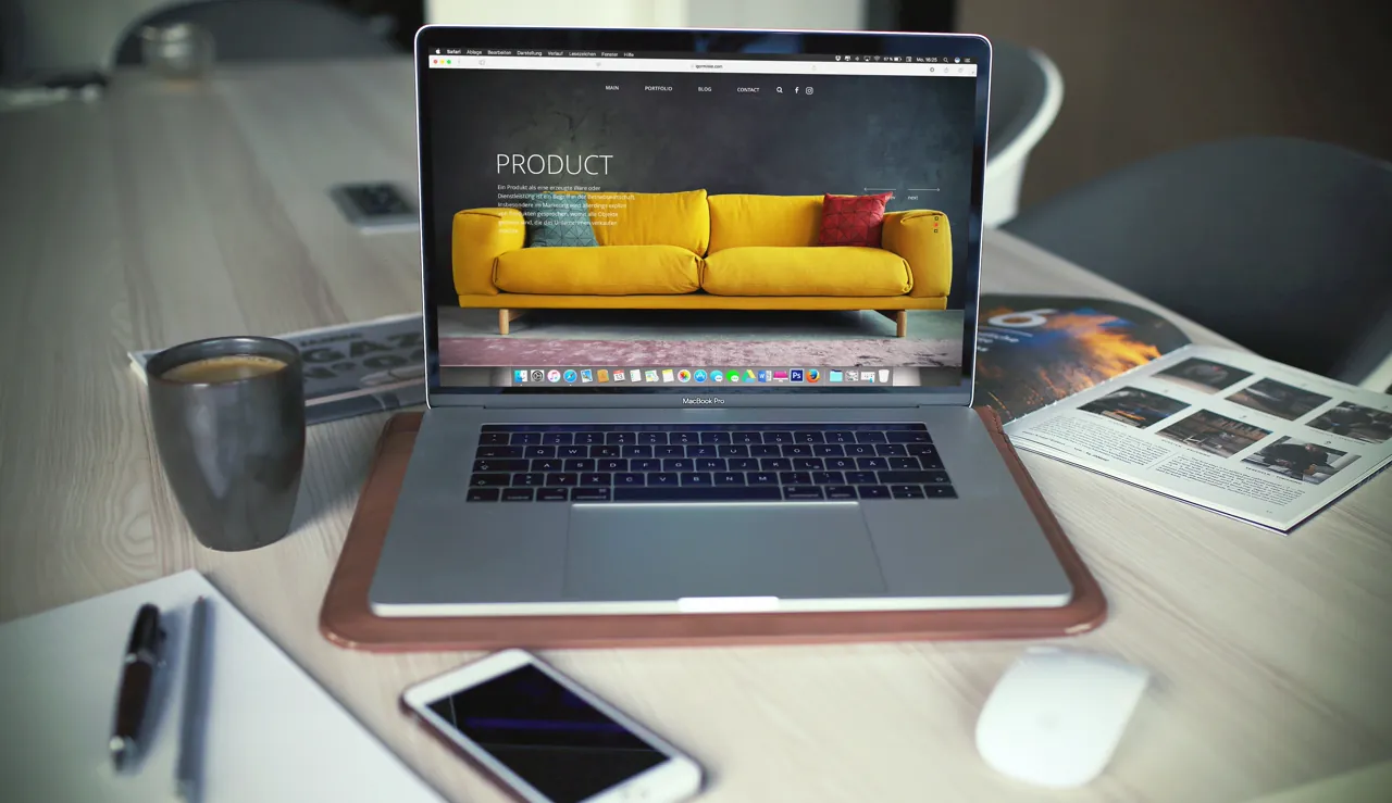 A modern small-business website displayed on a laptop on a tidy office desk